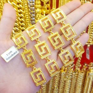 23K Gold Labyrinth Bracelet (1 Baht) held in a hand, showcasing the unique Greek Key design and deep 96.5% purity.