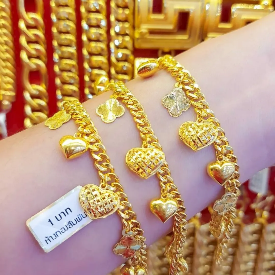 Solid 23K Gold Bracelet 15.2g (1 Baht) with charms.